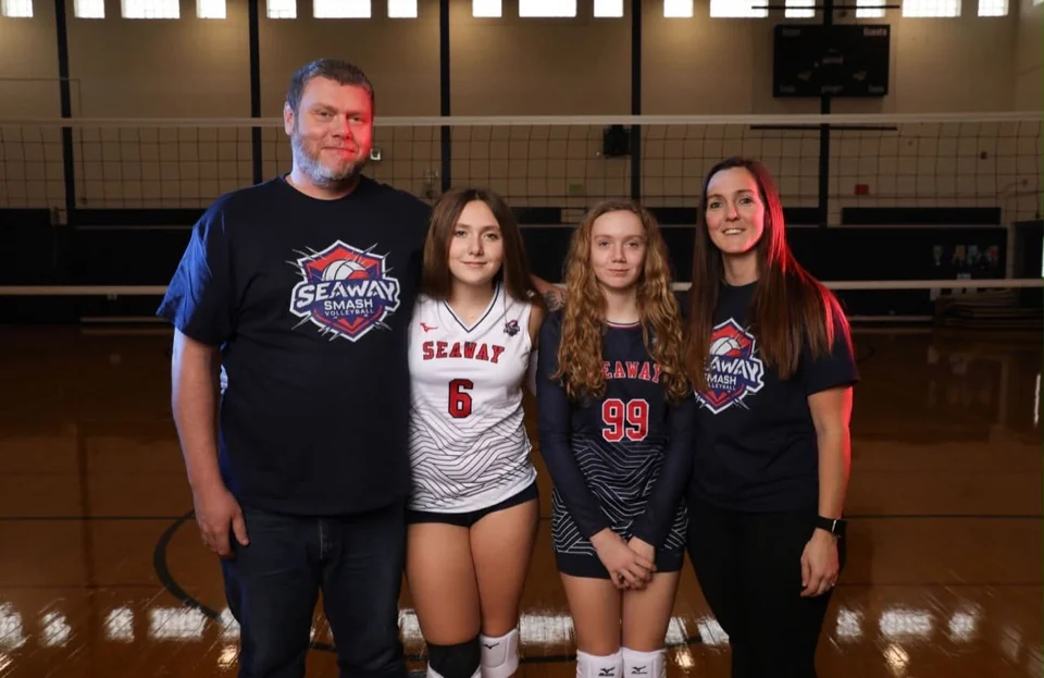 Mike and Alissa Stebbins with two Seaway Smash players on an indoor volleyball court.